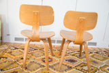 Pair of vintage Thonet style side chairs, blonde bentwood with curved backs.