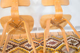 Vintage Thonet style chairs underside: curved light wood legs and bolted construction.