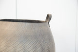 Dark grey recycled rubber basket with distinct tire tread texture and top handle.