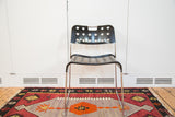 Retro Vintage Bieffeplast black lacquered metal chair with perforated seat and back.