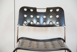 Perforated black lacquered backrest and seat of the vintage Bieffeplast Omstak chair.