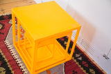 Tangerine orange vintage Lucite nesting cubes, glossy stacked form.
