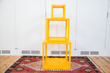 Stacked retro vintage tangerine orange Lucite nesting cubes, measuring 18, 14, and 9 inches.