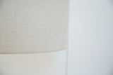 Light beige natural fabric texture on the Martz lamp's lampshade.