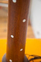 Martz Teak Lamp base detail with rich brown wood grain and oval pearly white inlays.
