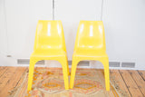 Pair of retro bright yellow Borg Wagner plastic chairs, 30 inches tall.