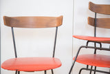 Curved Birchwood backrest and orange vinyl seat of a Mid Century Modern Pascoe chair.
