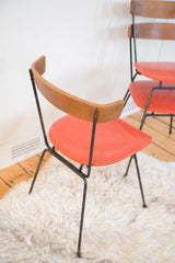 Clifford Pascoe Mid Century Modern chair back: curved Birchwood, orange vinyl, chipped black legs.