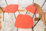 Curved Birchwood backrest and orange vinyl seat of a Mid Century Clifford Pascoe chair.