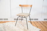 Vintage Clifford Pascoe Paul McCobb style chair with gray vinyl, birch back, black iron legs.
