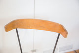 Vintage Clifford Pascoe chair's curved Birchwood backrest, showing wear and light scratches.