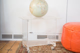 Vintage Lucite rolling cart table with two clear acrylic shelves and rolling casters.