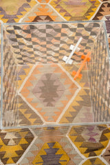 Overhead view of vintage Lucite cube, highlighting its interior black checkerboard art.