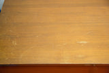 Vintage Herman Miller dresser top, light brown wood grain with varnish wear.