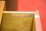 Close-up of original George Nelson Herman Miller label inside a vintage dresser drawer.