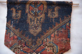 Rustic hand-knotted texture and geometric motifs on an antique Kurdish Malayer rug fragment.
