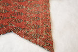 Hand-stitched border on the pointed tip of an antique Mir Serbend rug fragment.