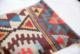 Detailed view of the antique Turkish kilim fragment's geometric flatweave, showing harmonious earthy tones.
