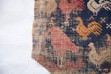 Rustic wool weave of an antique Persian fragment with pictorial red and orange roosters.