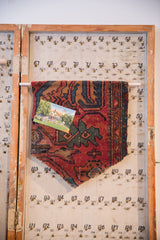 RUGLING 13, vintage Persian Lilihan hand-knotted rug fragment wall hanging in red, blue, green.