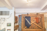 RUGLING 02 antique Kurdish rug fragment flag with geometric patterns in orange and blue tones.