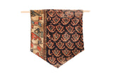 Antique Northwest Persian rug fragment with dark blue field, red motifs, and beige geometric border.