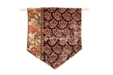 Late 19th century Northwest Persian rug fragment flag with dark blue and terracotta motifs.