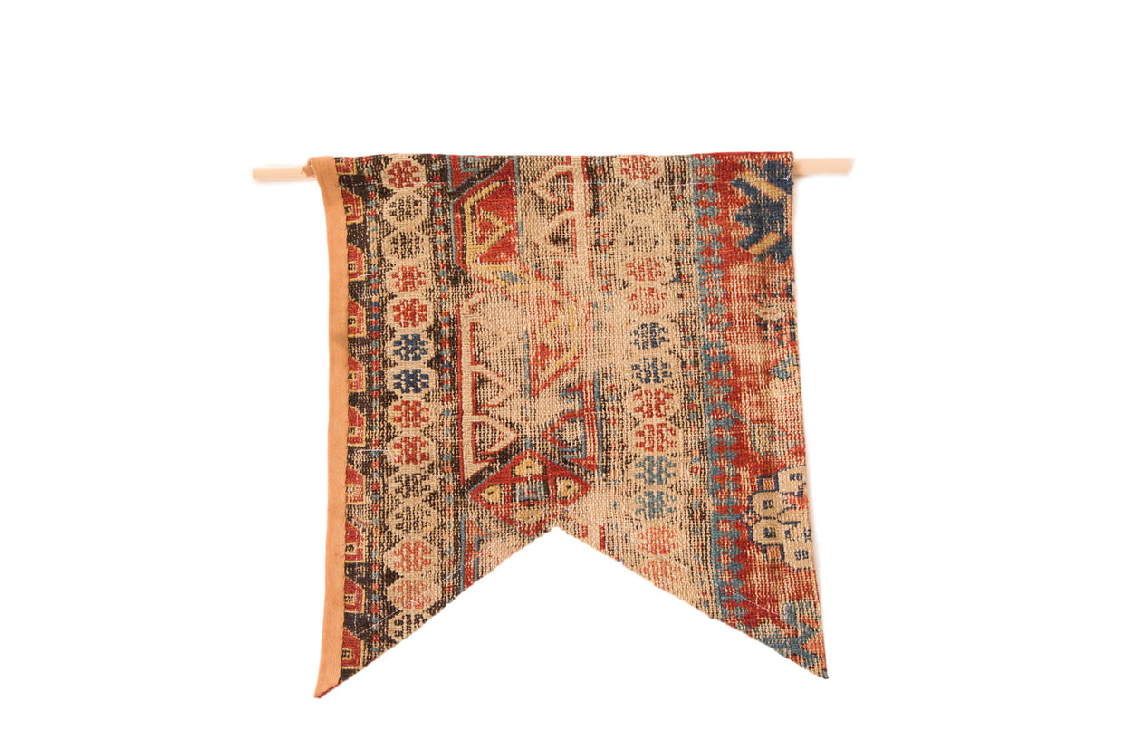 Antique circa 1900 Caucasian Soumac rug fragment flag, geometric patterns in red, blue, and natural tan.
