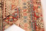 Antique Caucasian Soumac rug fragment showing geometric flat weave in red, blue, and tan.