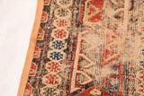 Flatweave antique Caucasian Soumac rug fragment with geometric red, blue patterns, and border.