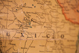 Antique wall map close-up, faded Mexico region on creased canvas, with Zaragoza.