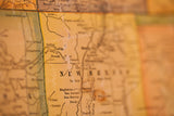 Aged canvas detail of the antique 1901 US map, showing New Mexico and Gallup.