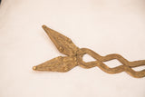 Textured bronze snake heads with artisanal detail and aged patina.