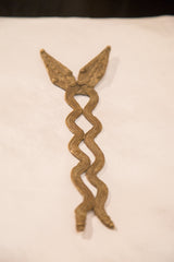Textured, wavy intertwined bodies of the vintage handmade bronze double snake.