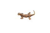 Vintage bronze gecko gold weight with a handmade texture and warm, aged patina.