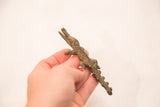 Vintage dark bronze crocodile sculpture, showcasing its textured, handmade details.