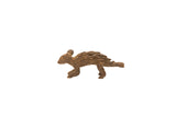 Vintage porcupine bronze gold weight, a handmade African sculpture with textured quills and a dark patina.