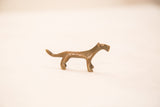 The stylized form and dotted texture of a vintage bronze cheetah figurine.