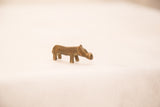 A tiny vintage Ashanti gold weight hippo with a smooth bronze patina.