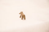 Rear view of the vintage hippo bronze gold weight highlighting its simple, handmade form.