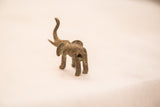 Vintage handmade bronze elephant sculpture, rear view with blue-green patina.