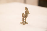 Side view of the vintage bronze rooster highlighting its oxidized patina and form.