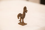 Vintage bronze rooster sculpture shown in profile, revealing a textured body and dark patina.