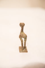 Vintage bronze pelican sculpture with a green patina, viewed directly from the front.