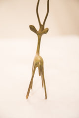 Rear view of the handmade bronze gazelle sculpture showing its slender form and tail.