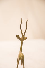 Slender neck and delicate antlers of the vintage bronze gazelle sculpture.