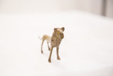 Vintage bronze lion sculpture with textured mane and light green patina.