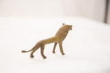Vintage handmade bronze lion gold weight, capturing its side profile and green patina.
