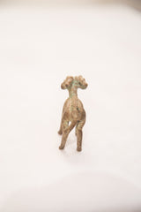 Back view of vintage bronze impala ram sculpture with blue-green patina.
