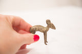 Vintage bronze female Ewe sculpture, showing time-softened patina and texture in hand.